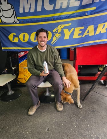 Happy customer with dog after tire installation at Fast Tire Shop East Los Angeles