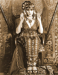 Silent film actress Theda Bara in 1917 movie Cleopatra, Wearing assuit dress