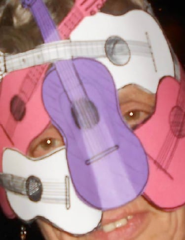 angi naylor with a guitar and a guitar in a mask