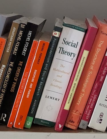 Academic books on social theory, sociological theory and sociology on a shelf.
