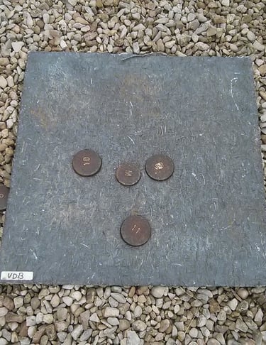 a stone slab with coins and coins on it