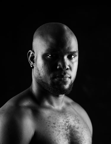 Bald Headshot Of Melvin Dain 