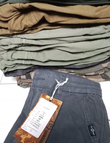 a pile of clothes and a tag tag on a table