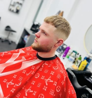 Man with blonde hair, skin fade and beard trim at Yau Barber Studio in Orsett, Essex