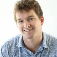 a man in a blue shirt and a white shirt