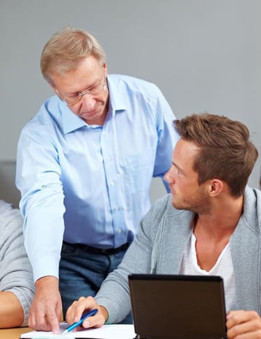 School psychologist or teacher working with student, progress evaluation, education follow-up, one-on-one session