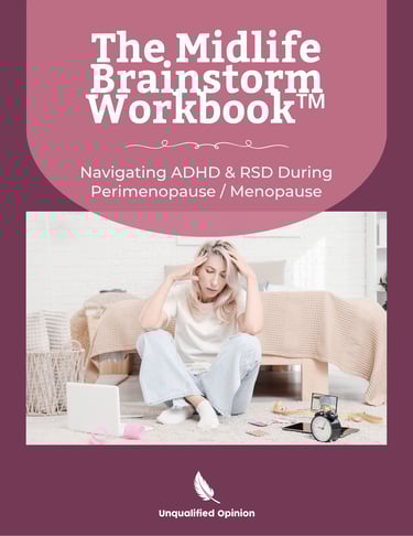 a woman sitting on a bed with a laptop and a clock