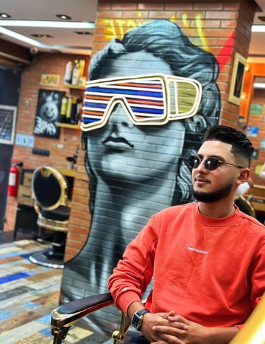 a man in a red shirt and sunglasses