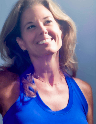 a woman in a blue tank top and a white shirt