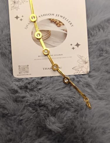 a gold bracelet bracelet with a gold chain bracelet