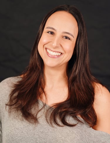 A photo of Silvia Saggiomo smiling warmly directly to the camera