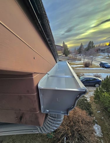 Seamless aluminum gutters and downspouts