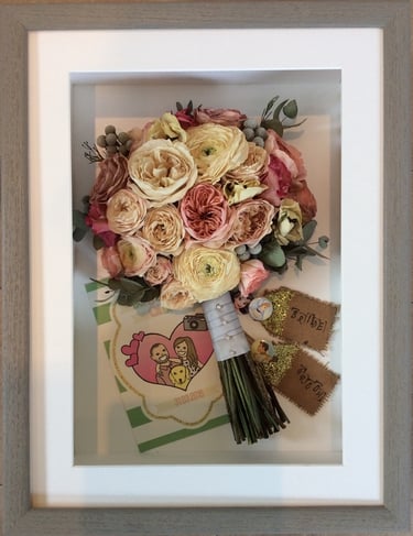 a side view preserved wedding bouquet with place names and invitations
