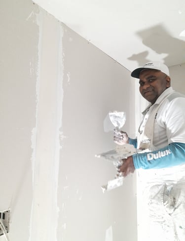 Dan plastering new gib in preparation to paint the walls