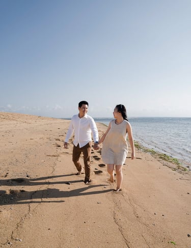 Intimate proposal couple walking on the beach at Sofitel Nusa Dua Bali