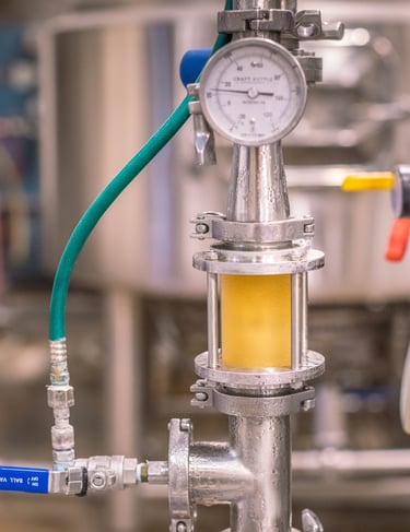 a beer pressure gauge gauged in a large metal tank