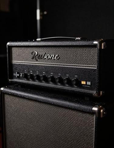 A close-up of a vintage amplifier glowing faintly in the dark, conveying a raw rock-and-roll vibe. Dark aesthetic with subtle gray and light gray accents. Western European / Dutch backstage setting.