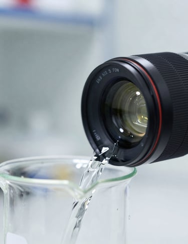 Close-up of a laboratory beaker pouring clear industrial solvent, bright clinical lighting, sharp focus, 35mm lens