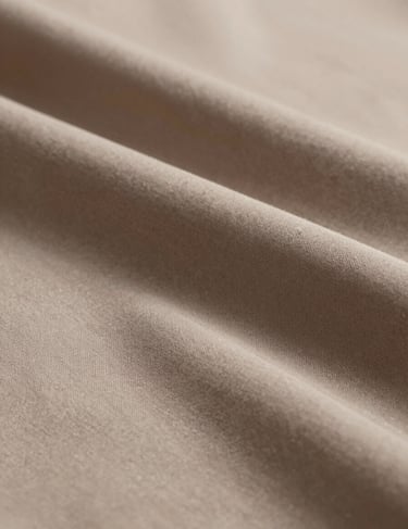 A high-resolution macro shot of a fabric texture in #3F5E5C, draped elegantly. The lighting creates deep shadows and bright highlights, emphasizing the material's quality and professional finish.