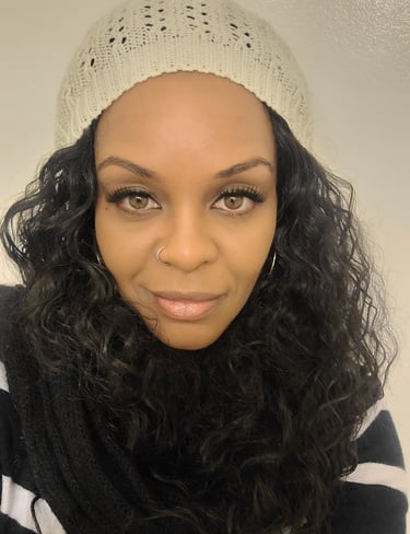 a happy woman with a white hat and a black scarf