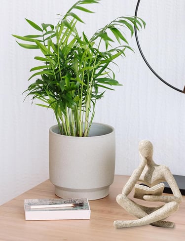 Abstract thinker reading statue, modern sculpture for living room shelf decor, and minimalist home decoration.