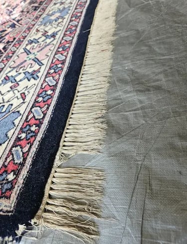 Oriental Wool Rug fringes needing correction, showing the majorcontrast between dirty and clean