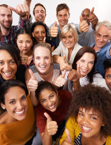 a group of people standing around a group of people with thumbs up