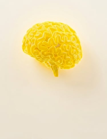 A 3D model of a bright yellow human brain centered on a neutral beige background representing mental health and cognitive