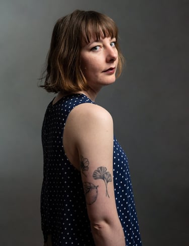 a woman with a tattoo on her arm