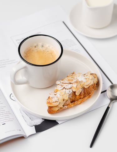 Coffee and a croissant in a cafe