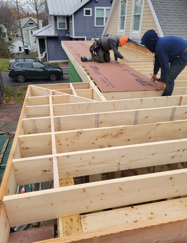 A man working on a new construction deck