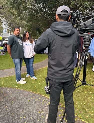 Nonprofit clients are interviewed by Television camera after media training