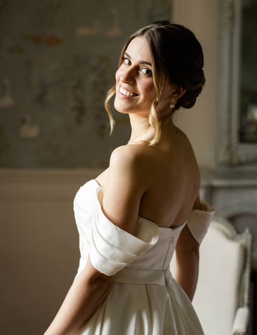 A bride smiling just after getting ready - Editorial, fine art photography