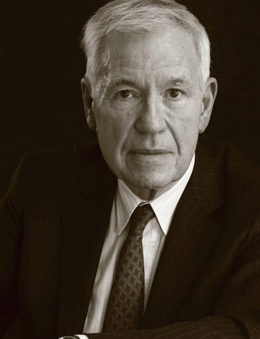 a man in a suit and tie with a watch