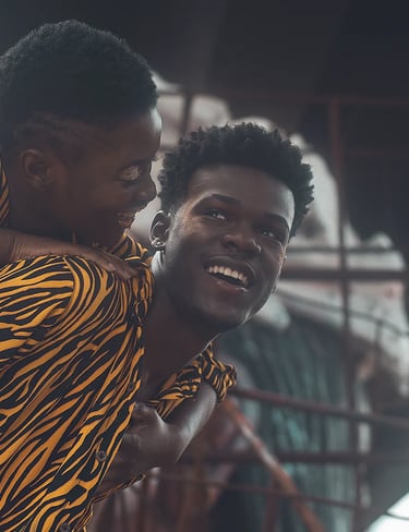 a man and a woman are smiling and laughing