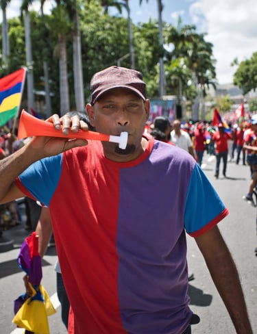 Participant blowing a vuvuzela during the celebration