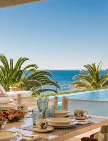 Poolside dining area at Villa El Rincon with sea views