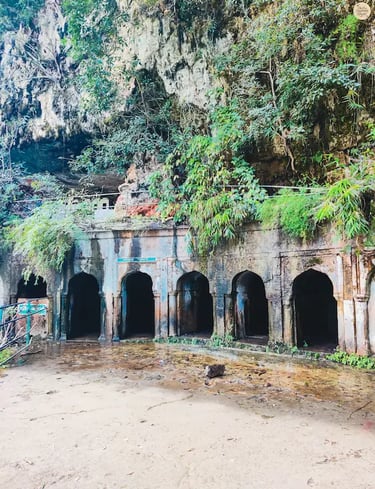 Five natural caves hidden in the forest cliffs at Pandav Falls, Panna Tiger Reserve, Madhya Pradesh.