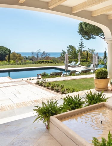 Terrace lounge at Villa La Gratitud with sea views and shaded pergola