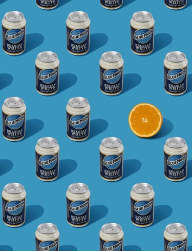 beer cans pattern and an orange