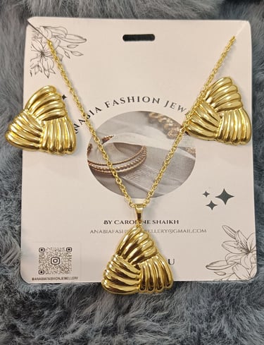 a gold plated necklace with a gold plated shell shell shell shell shell shell