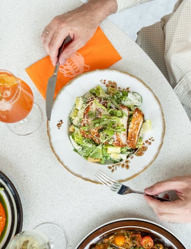 man eating a Caesar salad