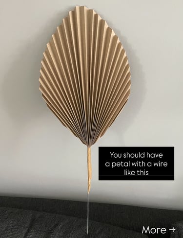 accordion-style folded flower petal for DIY lamp shade, taped with brown paper tape and wire