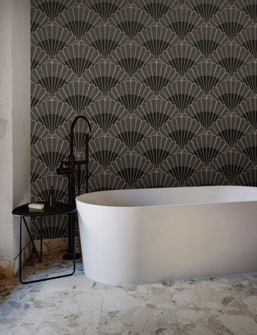 Charcoal and grey Art Deco wallpaper with bold fan motifs, styled in a modern bathroom with a freest