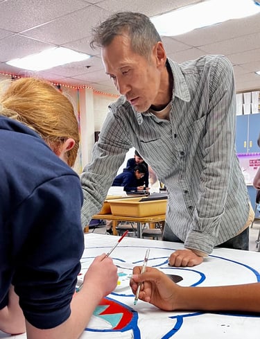 Arturo Ho works with students at Armistead Gardens (credit Jane Barbacane)