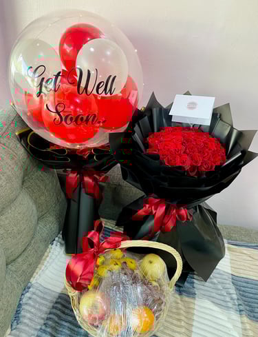 a basket of roses and a balloon - shaped balloon