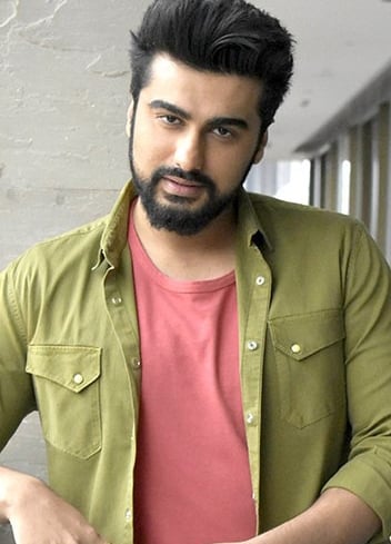 a man with a beard and a beard, wearing a green shirt