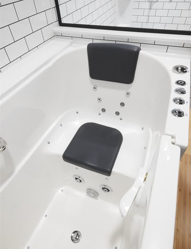 Walk-in whirlpool bathtub with built-in seat and jets installed by Toledo New Bath.