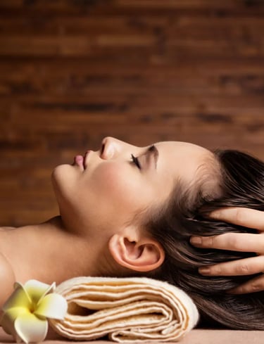 A woman receiving a relaxing professional head massage at a luxury wellness spa package resort.
