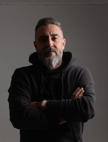 a man with a beard and a watch on his wrist